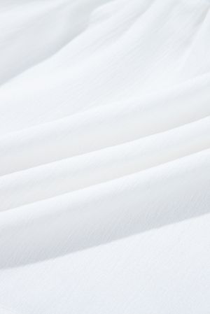 Дамска блуза в бяло със свободна кройка, флорална бродерия и връзки