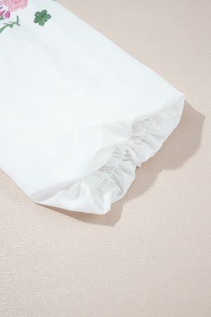 Дамска блуза в бяло със свободна кройка, флорална бродерия и връзки