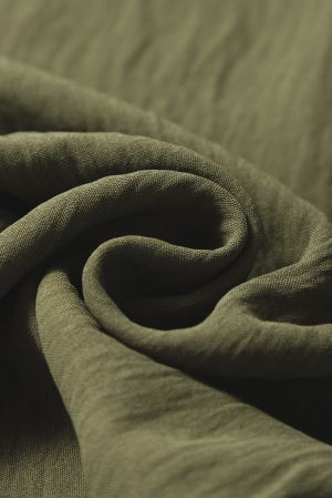 Дълъг дамски гащеризон в зелено с ефектни копчета и прав крачол