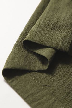 Дълъг дамски гащеризон в зелено с ефектни копчета и прав крачол