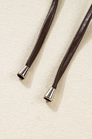 Дамско кафяво яке от еко кожа с копчета и връзки при подгъва