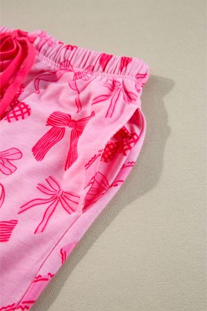 Дамски розов пижамен комплект от две части с принт на панделки